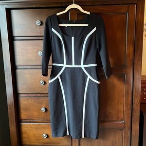 Black and white 3/4 sleeve dress. In excellent preowned condition.